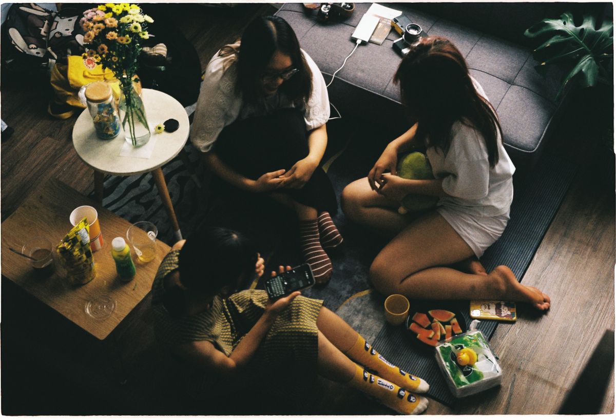 Friends gathered around a table, from above