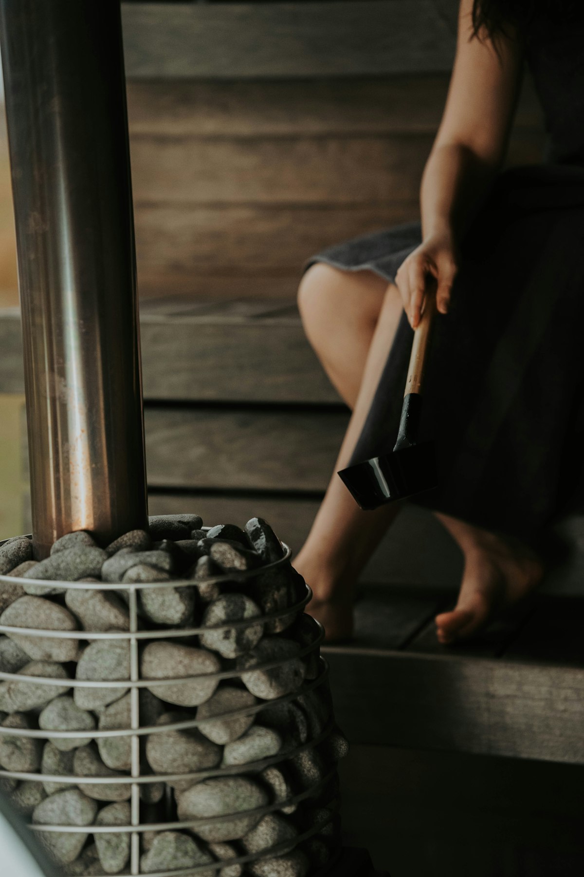 A sauna interior, warm wood and stone